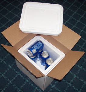 Open insulated box with blue cans of Pepsi on a checkered surface