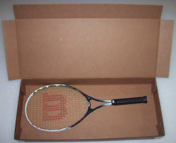 Tennis racket with Wilson logo in an open cardboard box on a white background