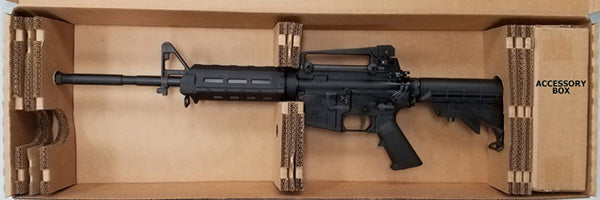 Black rifle in a cardboard box 